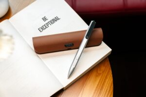 Product closeup silver pen leather case be exceptional book